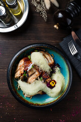 Lunch fried white fish with noodles, sauce and herbs.