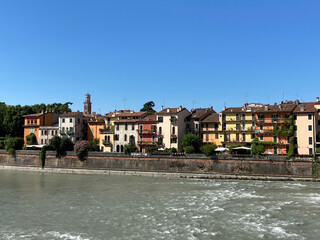 Houses in Verona in Italy with the river Adige in the foreground