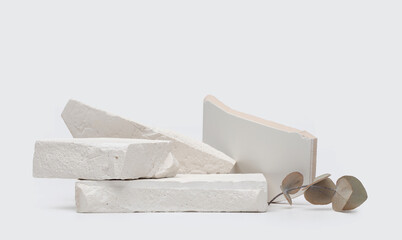 Stack white stones platform podium on gray light copy space background. Minimal empty display...