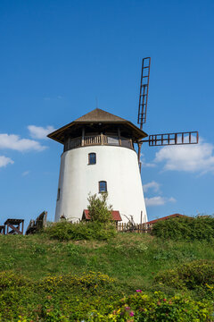 Old windmill in the background of blue sky