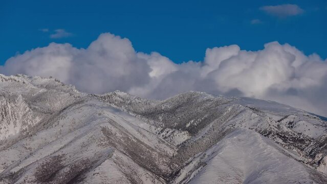 Time Lapse - Clouds over Snow-capped Mountains in Utah