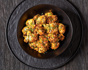 bang bang broccoli bites in bowl, top view
