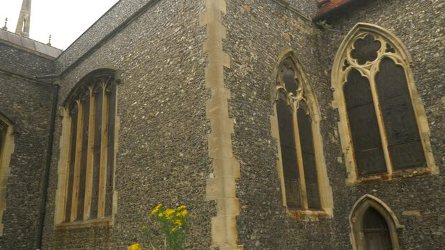 Ornate Stained Glass Window Church Cathedral Flint Stone Walls Pan