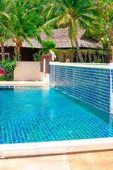 Swimming pool with clear water on site in the tropics for rest and relaxation
