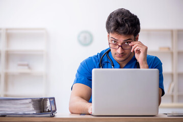 Young male doctor in telemedicine concept