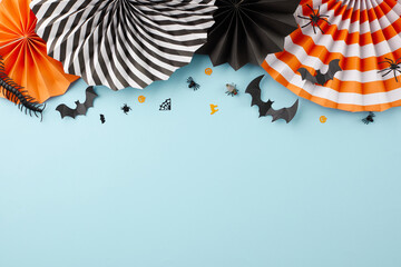 Join for a night of ghoulish delight at Halloween celebration. Top view flat lay of folding paper...