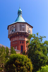 Fototapeta na wymiar Old brick water tower in Swidnica on a sunny day.