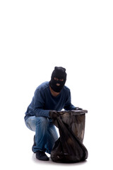 Young male burglar stealing money isolated on white