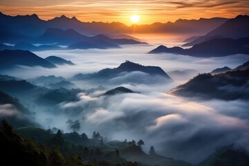 A high view sunrise or sunset over a mountain range low lying fog with mountain in silhouette, Stunning Scenic World Landscape Wallpaper Background