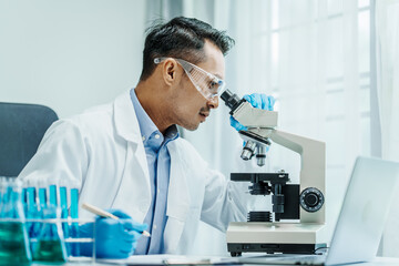 Asian male scientists white coat conducting research investigations medical laboratory, lab...