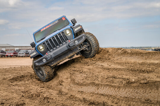 Loveland, CO, USA - August 26, 2023: Jeep Wrangler, Rubicon model, on a muddy training drive off-road course