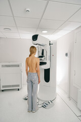 Woman doing mammogram x ray for breast cancer prevention screening at hospital. High quality photo