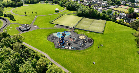 Aerial photo of Childrens Playpark playground at Larne Town Park with rides slides sandpits and...