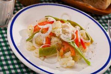 Fototapeta na wymiar Fresh salad with boiled cauliflower, green beans and bell pepper