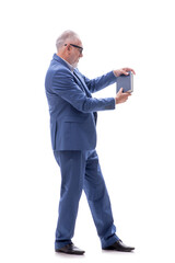 Fototapeta premium Old businessman holding book isolated on white