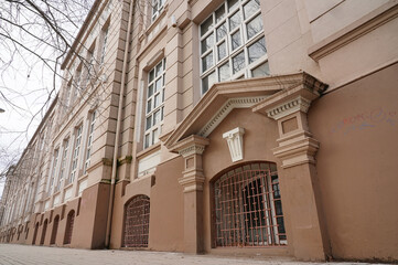 Facade of a colonial historic building converted in college in a small south american town during winter afternoon (Talca, Chile) 