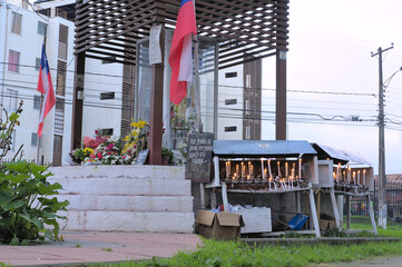 Candles in front of prayer place dedicated to Saint (