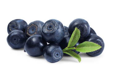 Tasty ripe bilberries and green leaves isolated on white