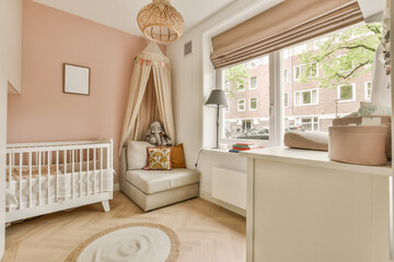 a baby's room with a cribt and a white cribt in the corner of the room