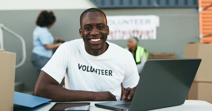 Man, volunteering and computer for online donation, community service and helping at NGO or nonprofit. Happy face of african person or volunteer on laptop, website charity and social media management