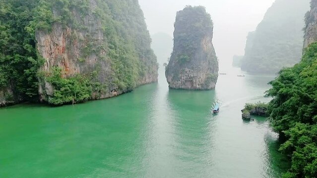 Aerial view amazing Panak island has a cave entrance into the canyon. .Visitors can take a canoe boat to see the big mangrove up in the valley..Panak island is the one landmark of Phang Nga Thailand