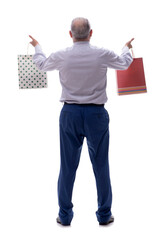 Old businessman holding bags isolated on white