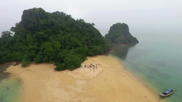 Aerial view amazing Panak island has a cave entrance into the canyon. .Visitors can take a canoe boat to see the big mangrove up in the valley..Panak island is the one landmark of Phang Nga Thailand