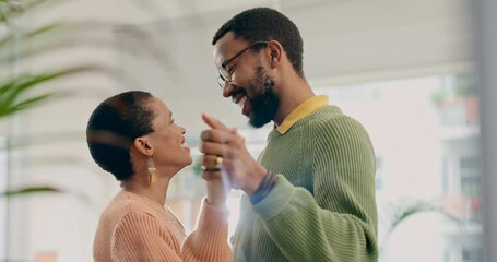 African couple, dancing and smile in home, love and bonding with care, marriage anniversary or funny memory. Black woman, man and happy dancer with romance, holding hands and moving together in house