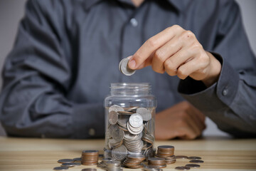 man with piggy bank The concept of bank account savings and investments to maximize profits.	
