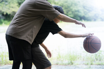 Parents and children playing basketball Faceless