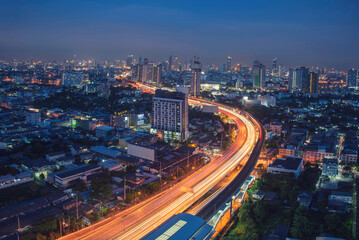 Fototapeta na wymiar Sunset Amazing Bangkok city skyline with blue sky. Golden time Beautiful skyscraper bangkok midtown landscape. Capital building background modern office district. downtown City night life