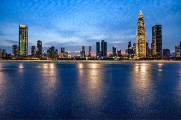 Fototapeta na wymiar Asphalt road and urban skyline with modern buildings at night in Shenzhen, Guangdong Province, China.