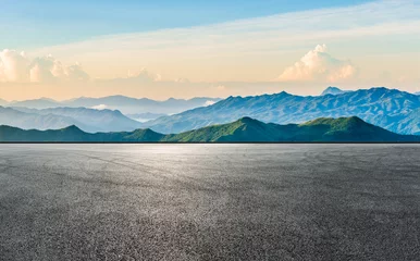Zelfklevend Fotobehang Asphalt road and mountain range natural scenery at sunrise. panoramic view. © ABCDstock