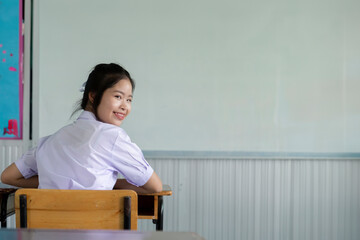 Thai girl student in the classroom preparing to study. Student back to shcool.