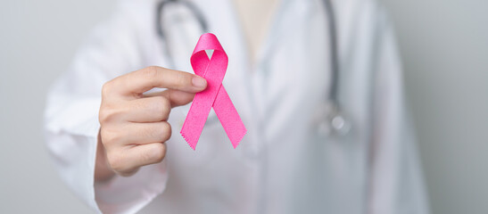 Pink October Breast Cancer Awareness month, doctor with pink Ribbon in hospital for support people life and illness. National cancer survivors month, Mother and World cancer day concept - obrazy, fototapety, plakaty