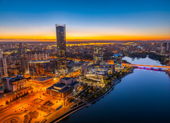 Yekaterinburg city and pond aerial panoramic view at summer or early autumn night. Night city in the early autumn or summer.