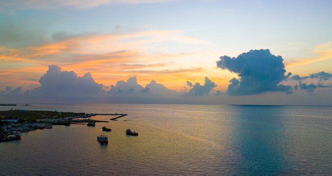 Aerial view with jetty port and sunset sky scene background