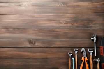 Variety of tools on wooden background. Top view with copy space