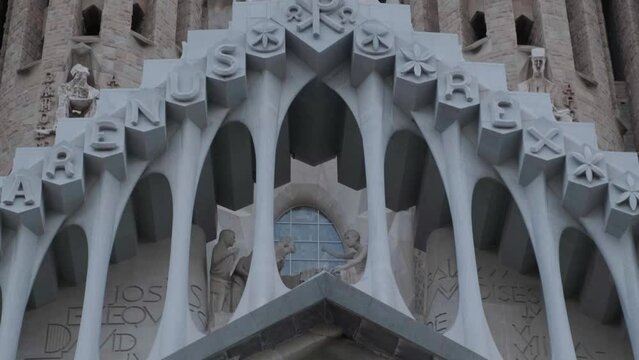 Sagrada Familia Passion Facade Details and Close Up Crucifixion Tilt Down 4k 25fps