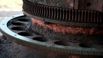 Old rusted steel metal gears on a world war cannon in the South Pacific - Powered by Adobe