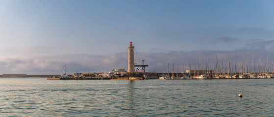 Panoramic of the Môle Saint Louis and its lighthouse and the marina, in Sète, Occitanie, France