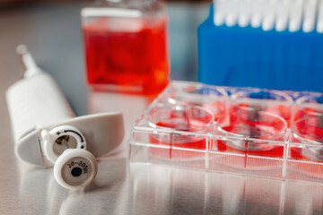 Cell culture media in laboratory for pipet.