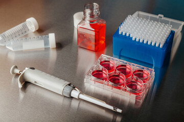 Cell culture media in laboratory for pipet.