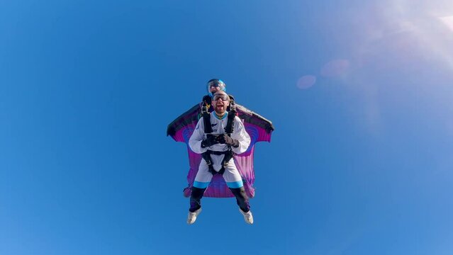 Thrilling adrenaline pumping tandem wingsuit skydiving freefall flying