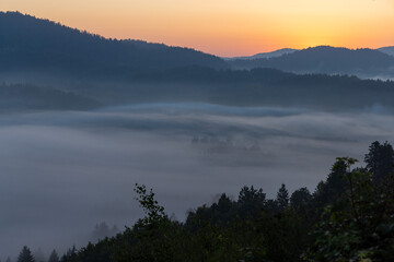 Dawn with golden morning mist in a mountain valley, Croatia