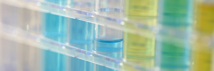 Test tubes with yellow and blue reagent, shallow focus