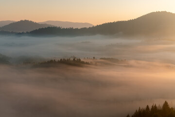 Dawn with golden morning mist in a mountain valley, Croatia