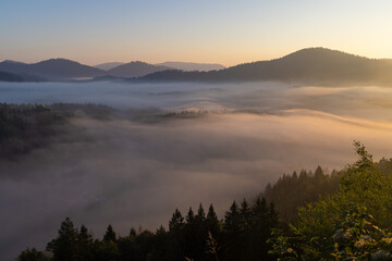 Dawn with golden morning mist in a mountain valley, Croatia