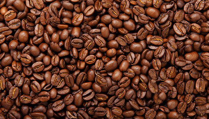 Fototapeta premium Coffee beans background. Roasted coffee beans close up