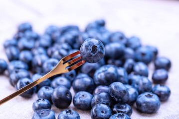 Freshly picked blueberries on a metal fork. blueberries close up